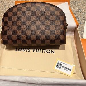 Louis Vuitton cosmetic bag. Tags, receipt, box, dust cover & bag. New in box!